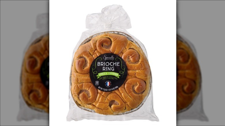 Specially Selected Apple Cinnamon Brioche Ring in a foil pan wrapped in a clear plastic bag