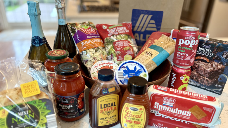 A grouping of name brand products with their Aldi brand dupes