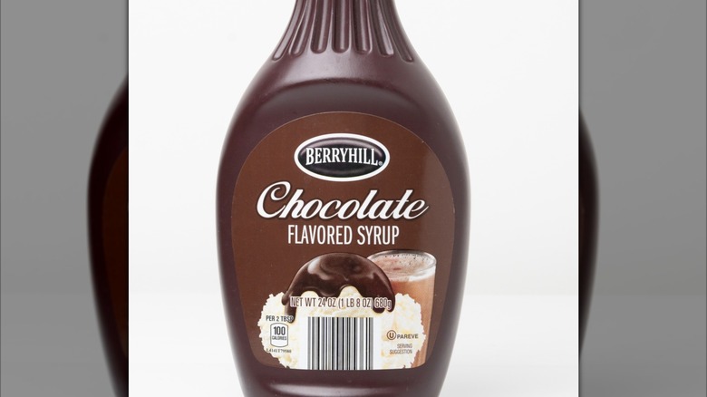 Plastic, single-use container of Berryhill brand Chocolate flavored syrup sold at US Aldi stores, used as a dessert topping