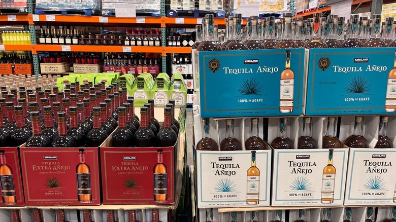 Liquor section at Costco warehouse showing cases of bottles of Kirkland Singature Tequila