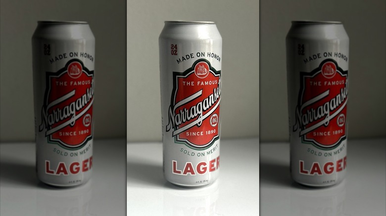 Tall can of Narragansett lager on a white background on table, mirrored