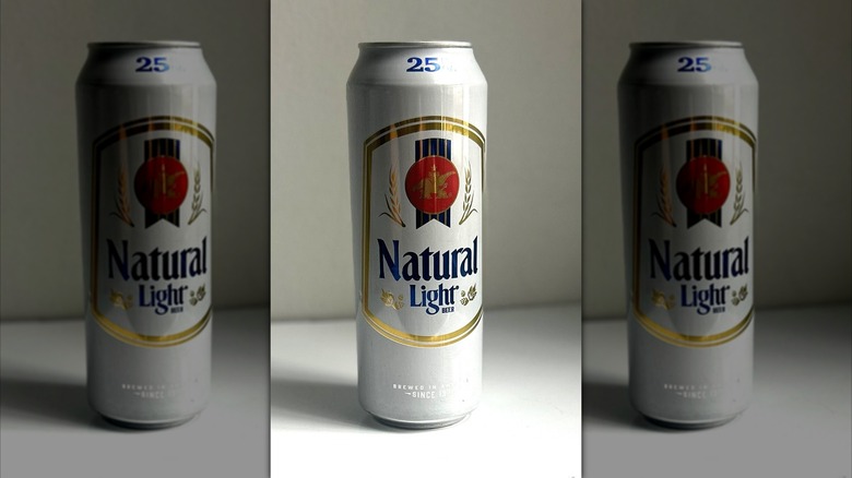 Tall can of Natural Light beer on a white background on table, mirrored