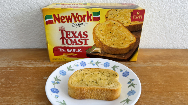 New York Bakery Texas toast slice on a small plate in front of its box