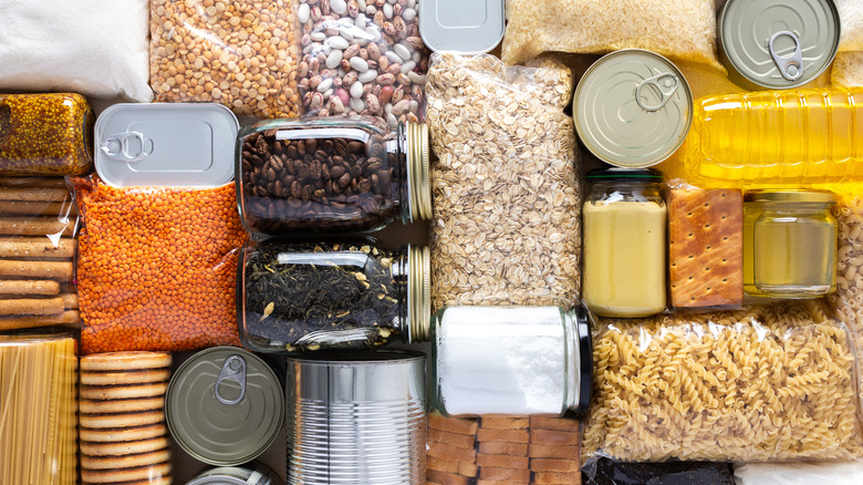 Home food supplies for quarantine and isolation, including canned food, cereals, pasta, and essential staples