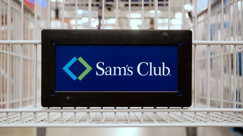 The Sam's Club logo on a white shopping cart.
