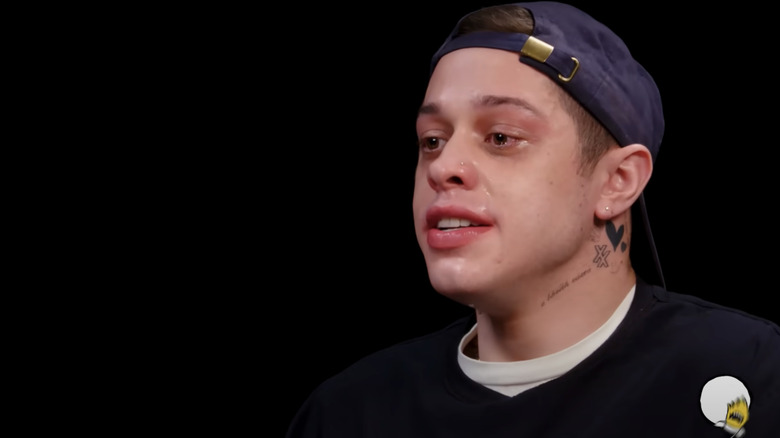 Pete Davidson falling apart after eating Da' Bomb hot sauce