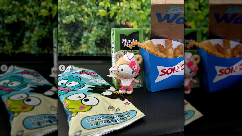 Sonic Wacky Pack Kids' Meal unpacked on table with a Hello Kitty toy, French fries, and apple juice