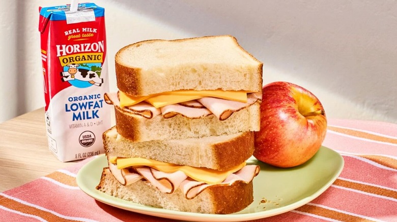 Panera Bread kids meal with a turkey and cheese sandwich, an apple, and a box of Horizon organic lowfat milk
