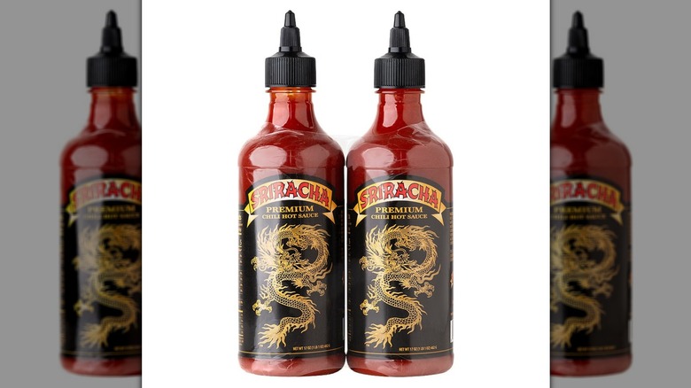 two bottles of sriracha sauce