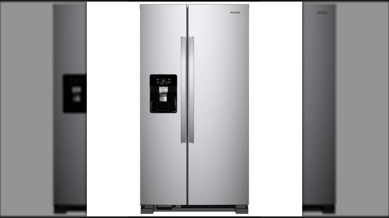 Whirlpool side by side refrigerator against a white background