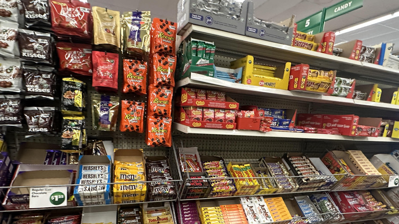Snacks and candy at Dollar Tree lined up on the store shelves.