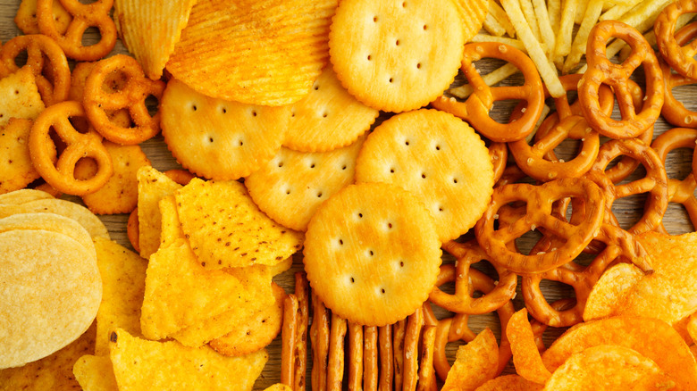 Assorted chips, crackers, and pretzels