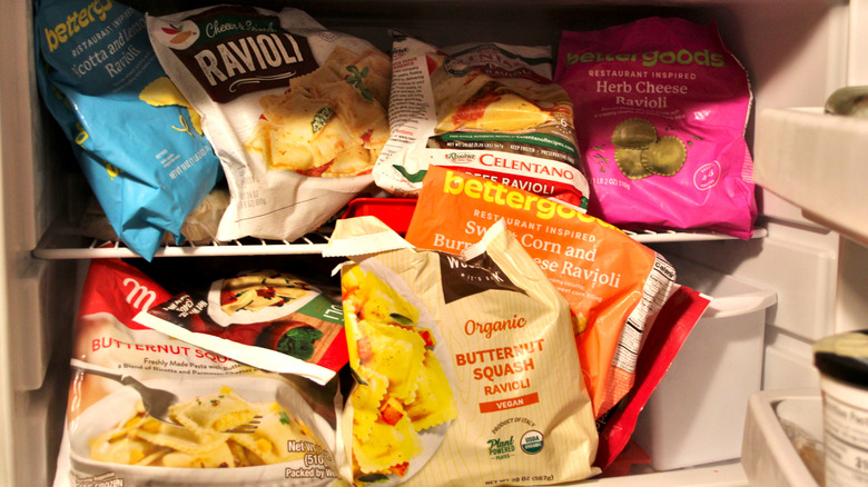 A selection of 13 different bags of frozen ravioli from a selection of different brands