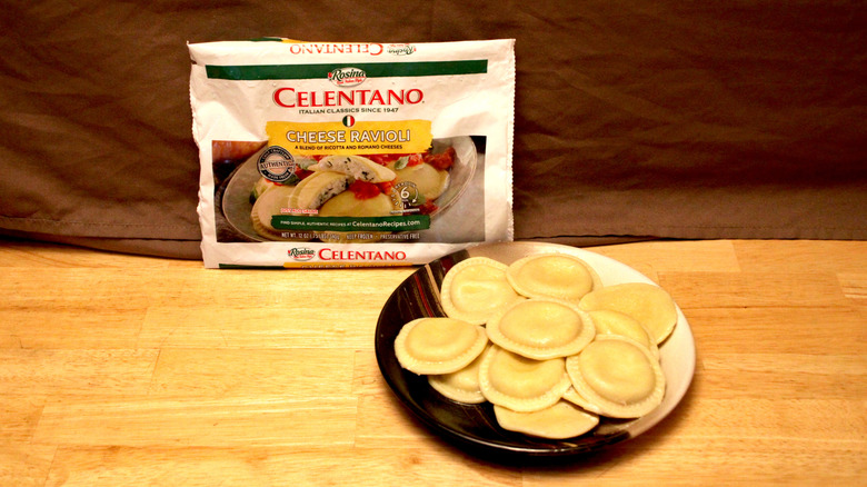 A cooked plate of Celentano brand Cheese Ravioli placed beside the bag it came in