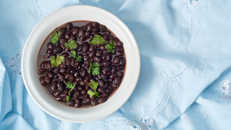 Bowl of black beans with cilantro
