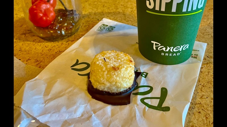 Macaroon on Panera table next to cup