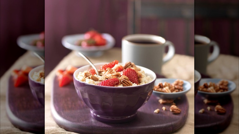 Bowl of oatmeal with strawberries and pecans