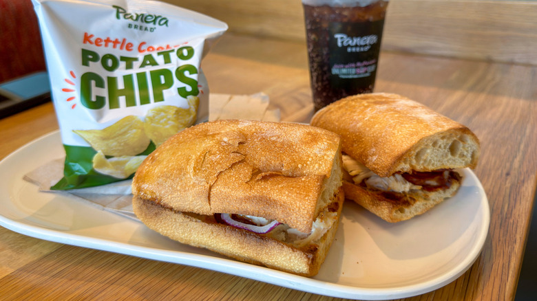 Panera sandwiches, drinks, and chips on table