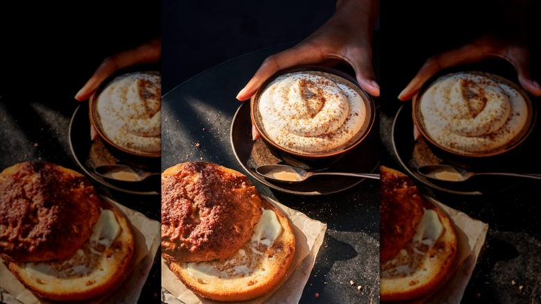 Cinnamon crunch bagel next to latte