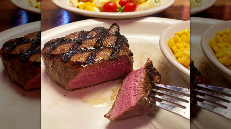 Fork piercing cut steak