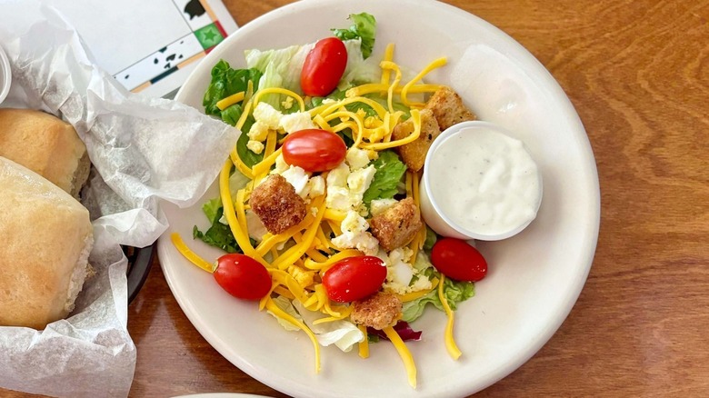 Salad with tomatoes, croutons, cheese, and egg