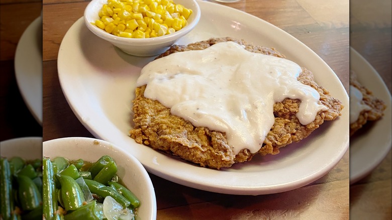 Country fried chicken with gravy, corn, and green beans
