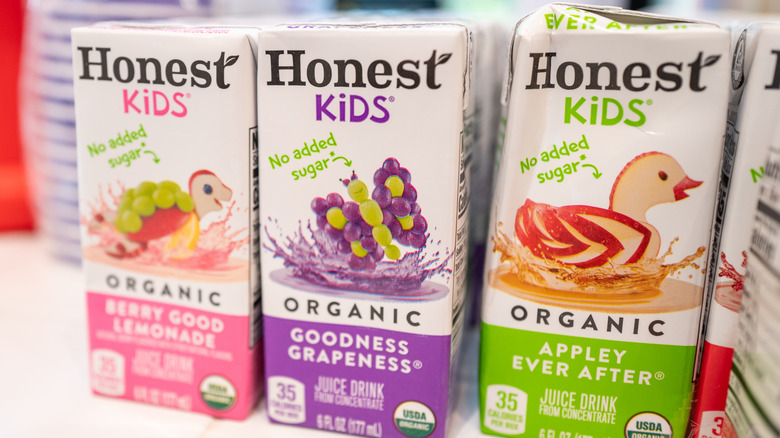 Different Honest Kids Organic Juice Drink boxes sitting next to each other