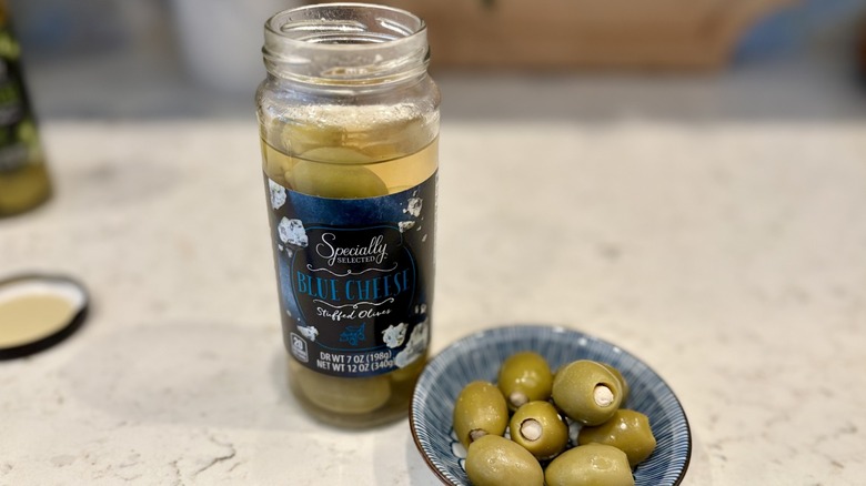 An open jar of Aldi Specially Selected blue cheese stuffed olives