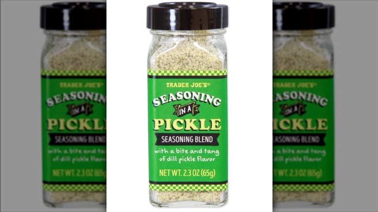 Shaker of Trader Joe's Seasoning in a Pickle Seasoning Blend on white background