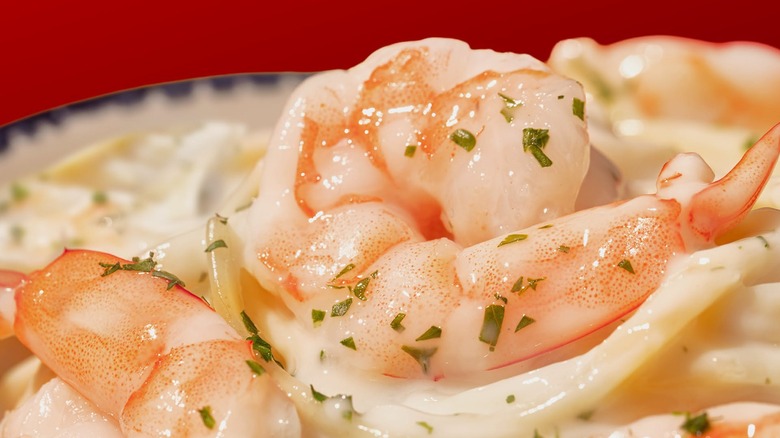 A close up of boiled Red Lobster shrimp with seasoning