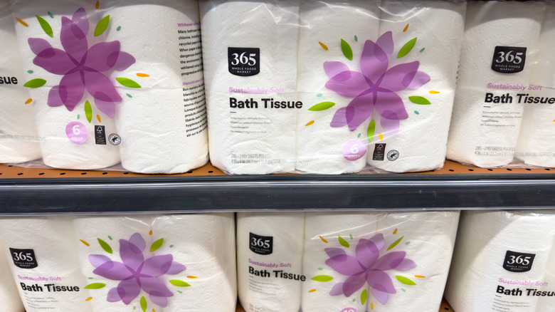 Shelf stocked with rolls of 365 Bath Tissue