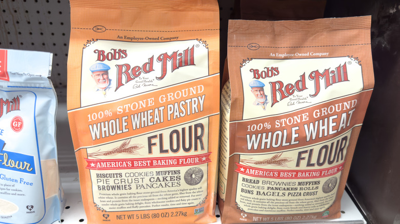 Two bags of Bob's Red Mill flour on a store shelf