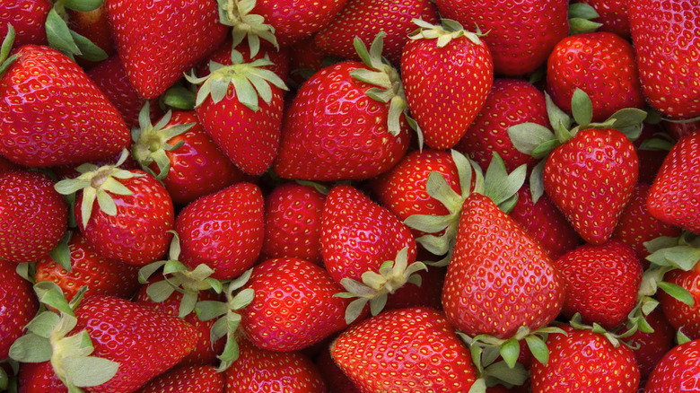 Pile of bright red whole strawberries