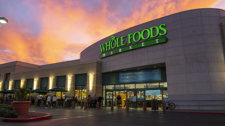 A Whole Foods location with an orange sunset in the background