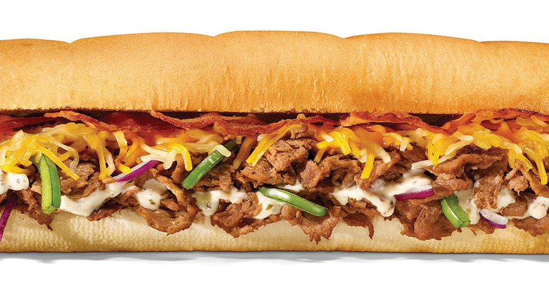 Subway The Monster foot long sub sandwich on white backdrop