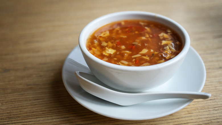 Hot and sour soup on white bowl