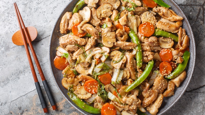 Moo goo gai pan with chopsticks