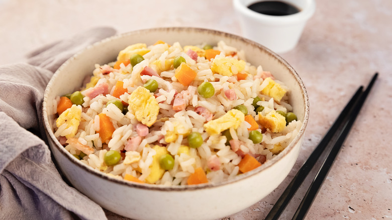 Fried rice with chopsticks and soy sauce