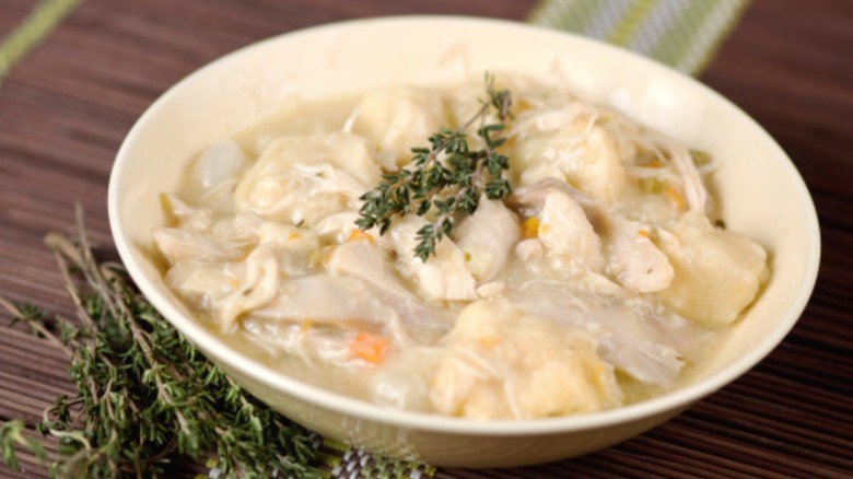 A bowl of chicken dumpling soup.