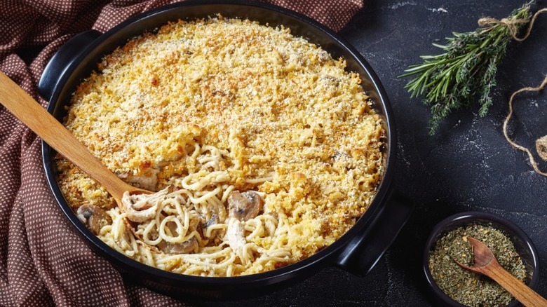 A pan of turkey tetrazzini on a black table