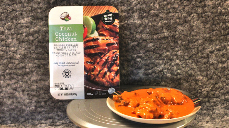 A plate of Park Street Deli Thai Coconut Chicken beside the package it came in