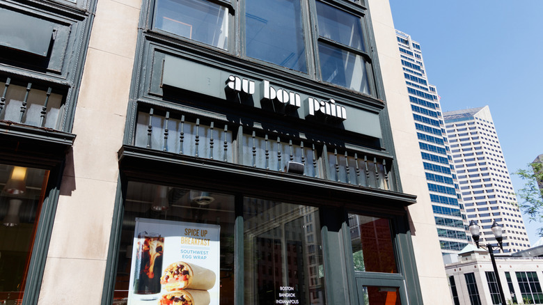 Low-angle exterior shot of an Au Bon Pain, day