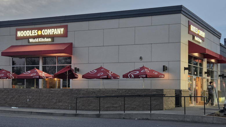 Exterior of Noodles & Company, night