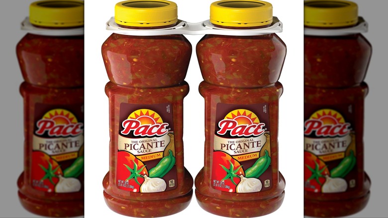 Two jars of Pace Original Picante Sauce on white background
