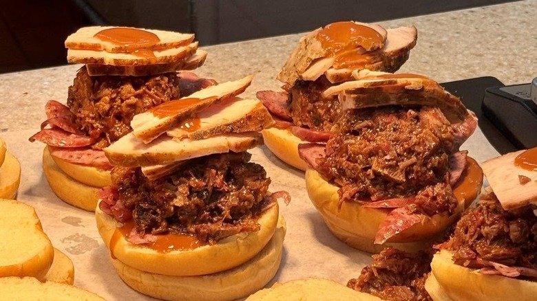 The Three Meat Sandwich from Buc-ee's being assembled.