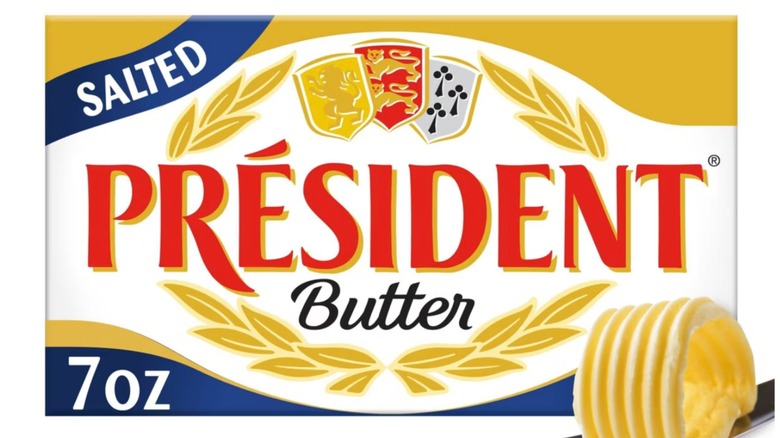 Président Salted Butter package with butter on knife in right corner on a white background.