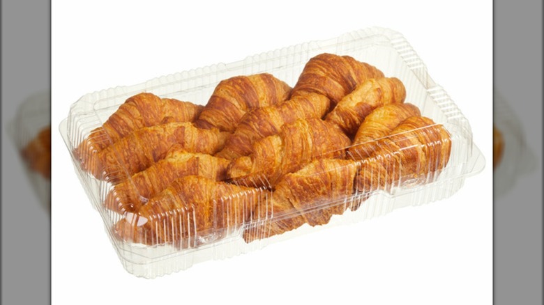 A plastic container of the Kirkland Signature Butter Croissants from Costco