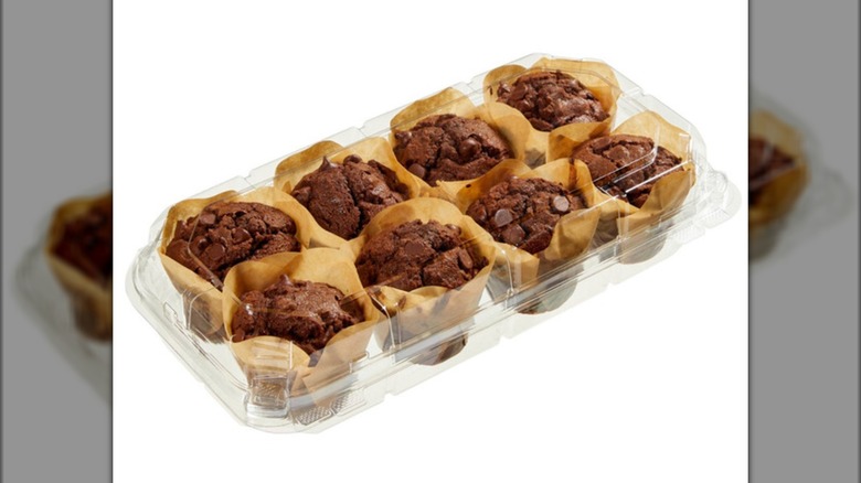 A plastic container of the Kirkland Signature Triple Chocolate Muffins from Costco