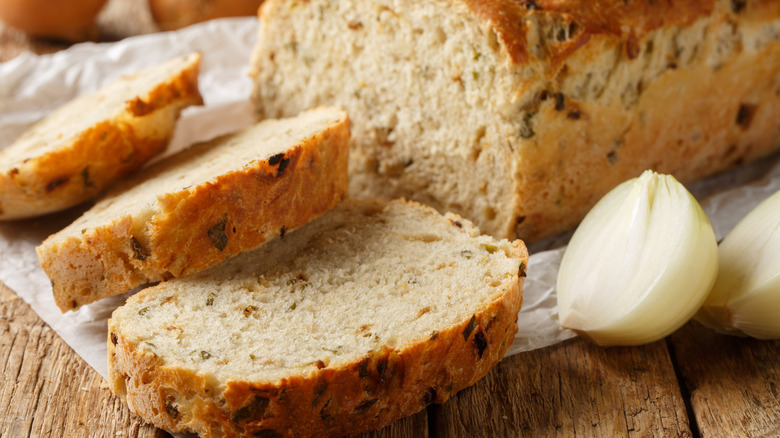 Slices of onion bread with raw onion on the side