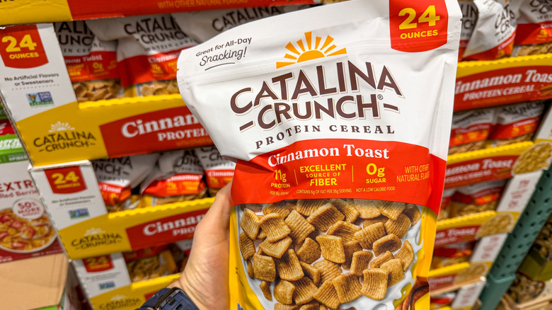 Someone holding bag of Catalina Crunch cereal at Costco.